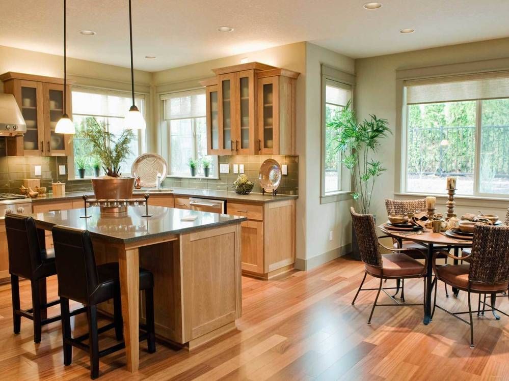Classic kitchen with stone counters and light brown wooden floor