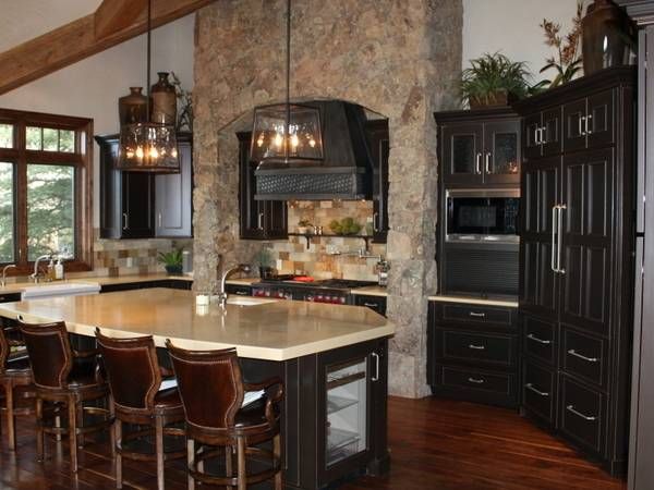 Kitchen with stone fireplace and oven
